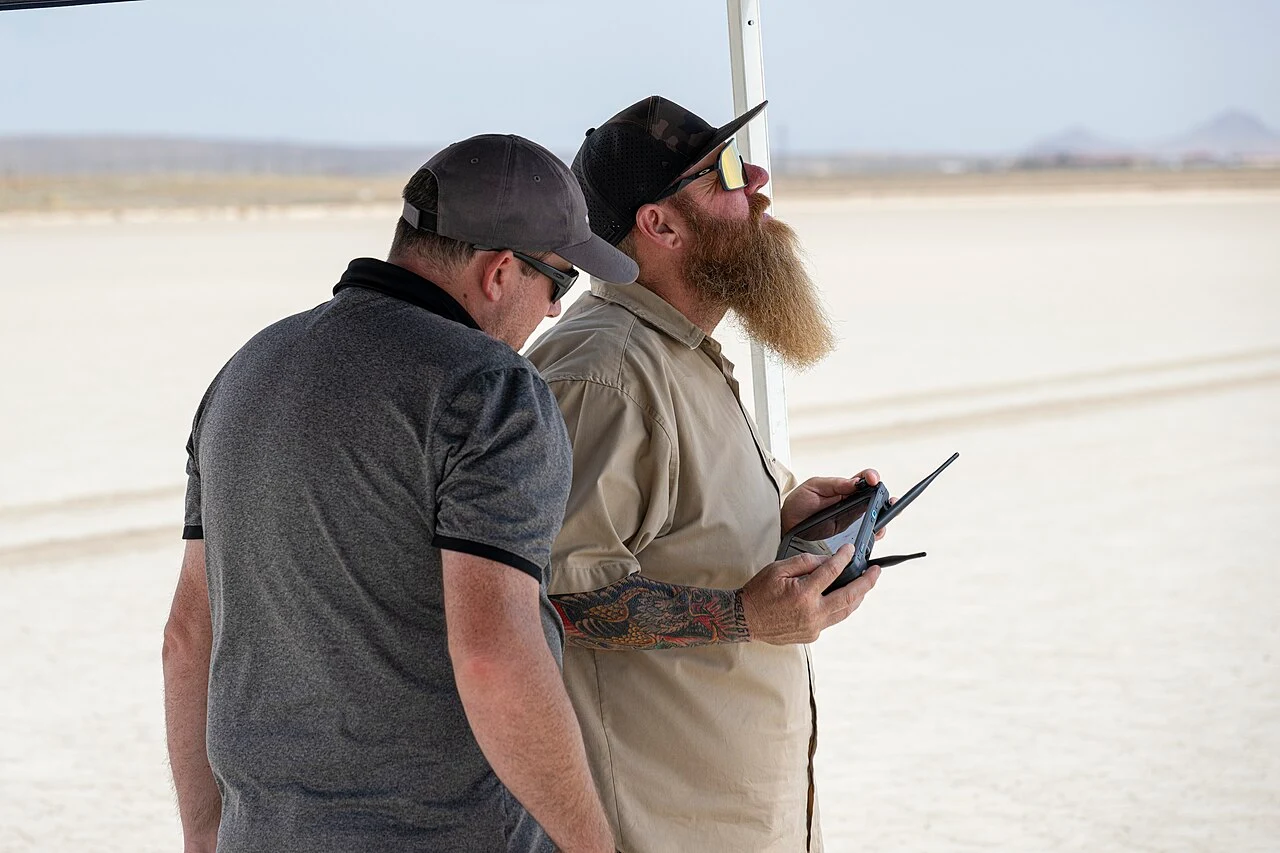 NASA remote pilots using handheld controls during a drone test